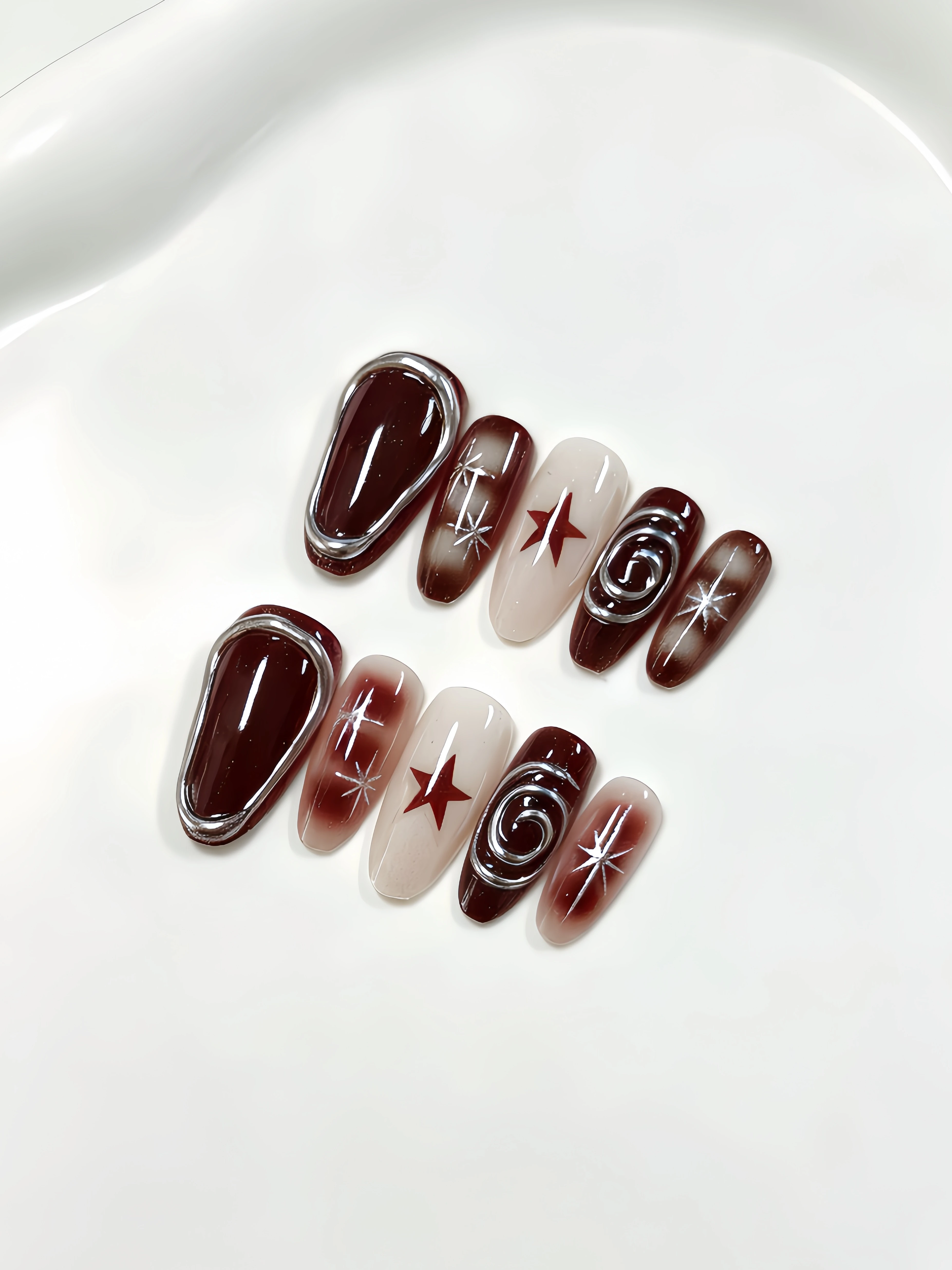 10-Piece Almond-Shaped Press-On Nails, American Retro Spicy Girl Nail Art, Burgundy Gradient Five-Pointed Star Press-On Nails, Y2K Millennium 3D Silver Spiral Metallic Long Art Nails, Reusable Fake Nails for Music Festivals, New Year's Eve, and Halloween Atmosphere