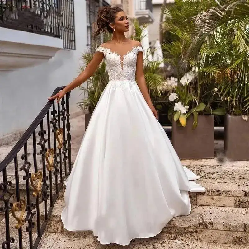 

Elegant Satin A Line Wedding Dresses Sheer O Neck Lace Appliqued Boho Simple With Cap Sleeves Back Buttons Sweep Train Vestidos