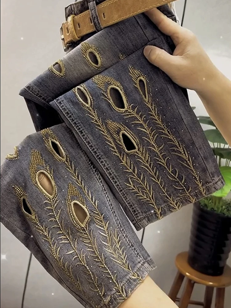 

Women Slim Fit and Versatile High Waist Elastic Jacquard Embroidered Hollow Out Jeans Spring New Fashion Harlan Pants