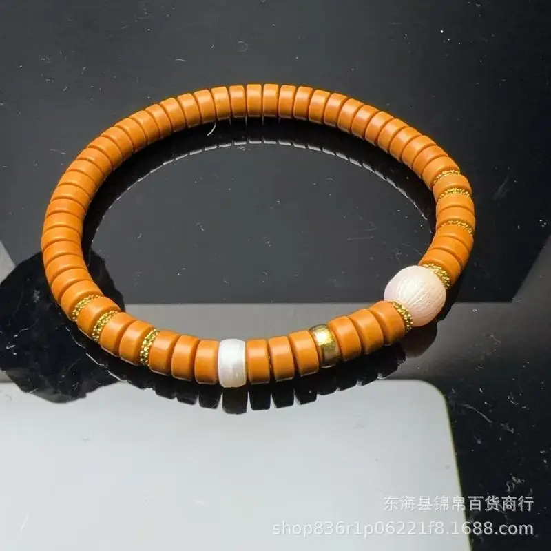Olive Pit Wall Tablets Paired With A Pearl Bracelet Jewelry