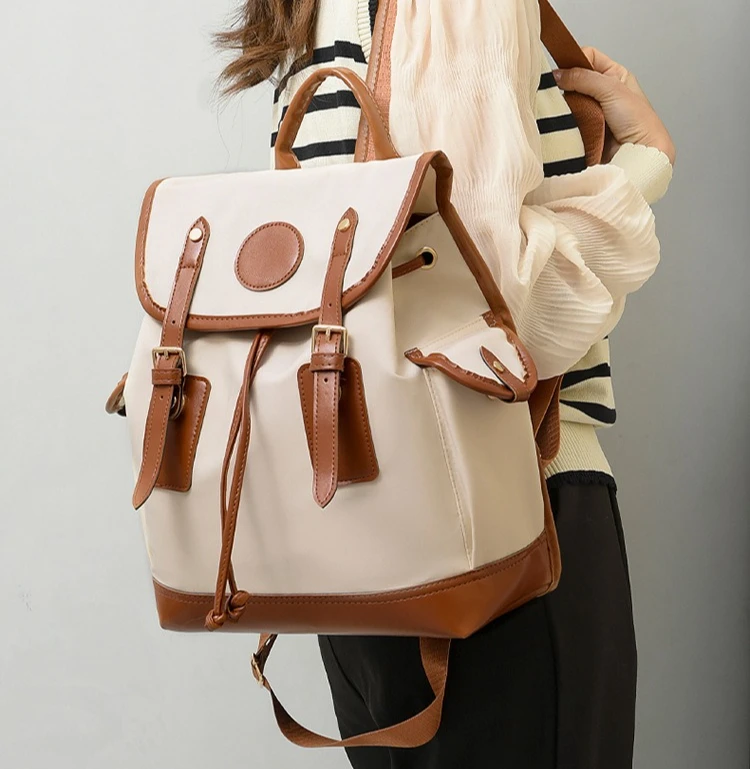 Large-capacity female waterproof Oxford spliced color-blocking flip cover lock travel hand-held backpack