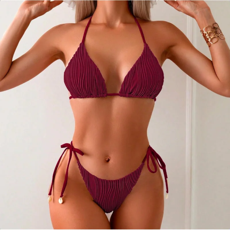

2026New e-commerce exclusive two-piece bikini women's swimsuit with shell ties, solid color fabric, and built-in chest pads