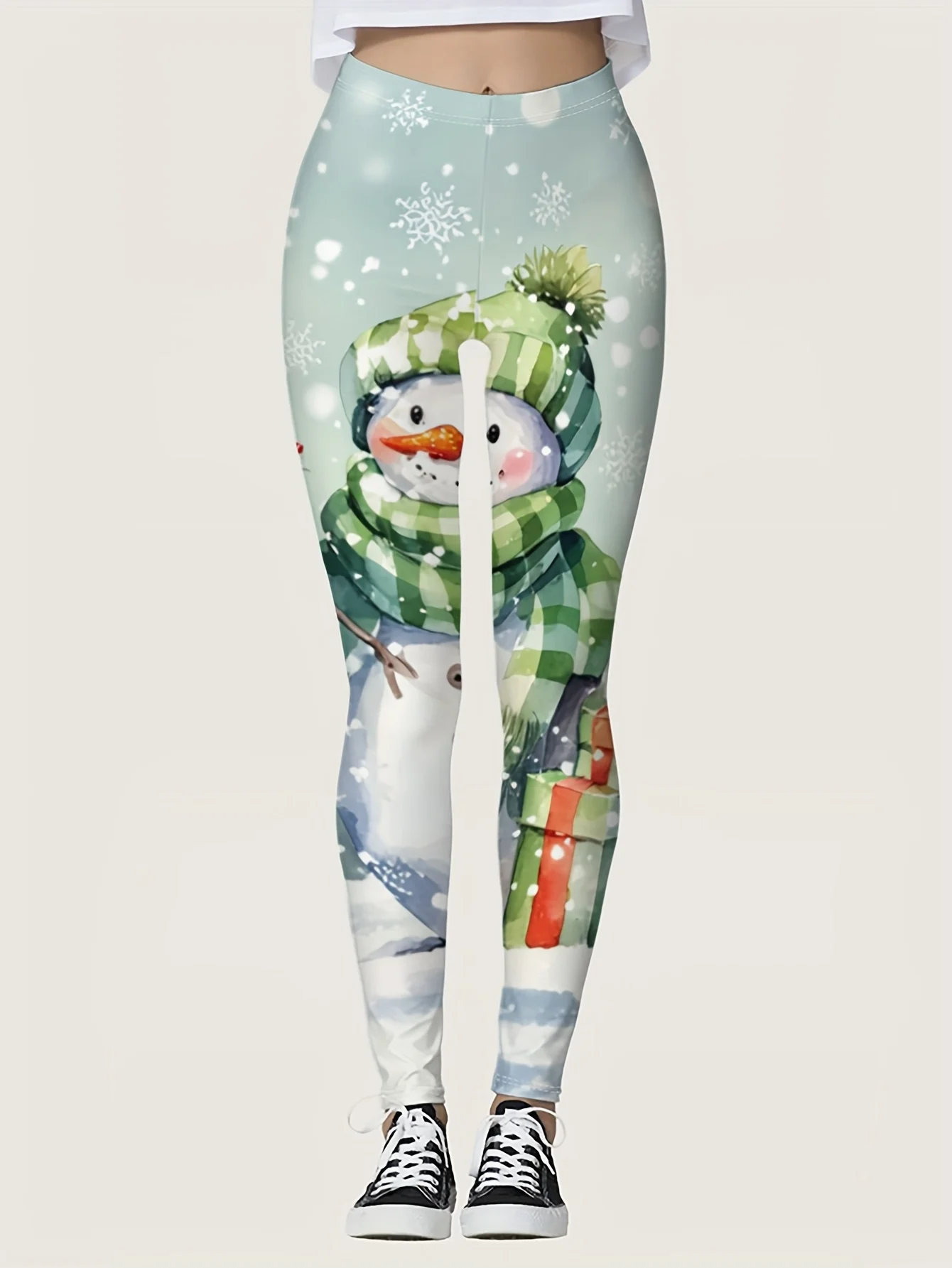 

Women's leggings with Christmas snowman print made of polyester and spandex blend,stretchy and warm,perfect for autumnand winter