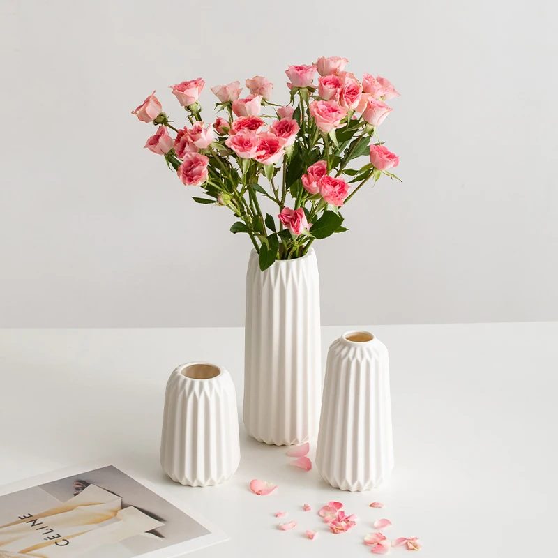 

Ceramic vase with Nordic minimalist design and white origami texture