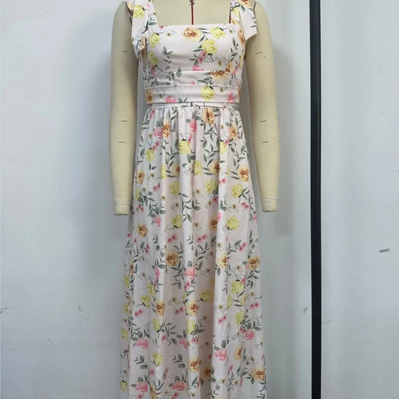 夏エレガントなノースリーブフラワープリントドレス弓サスペンダースクエアカラーハイウエストルーズ中空オフショルダービーチロングドレス