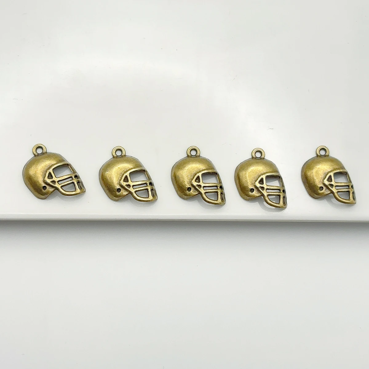 15 Pieces of Rugby Helmet Small Accessories, Hollow Mask Retro Sports Helmet Style, Suitable for DIY Bracelets, Necklaces, Earrings, and Handmade Beaded Decoration Accessories