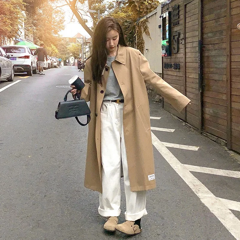 

A long-sleeved khaki coat with small lapel for women featuring wide design