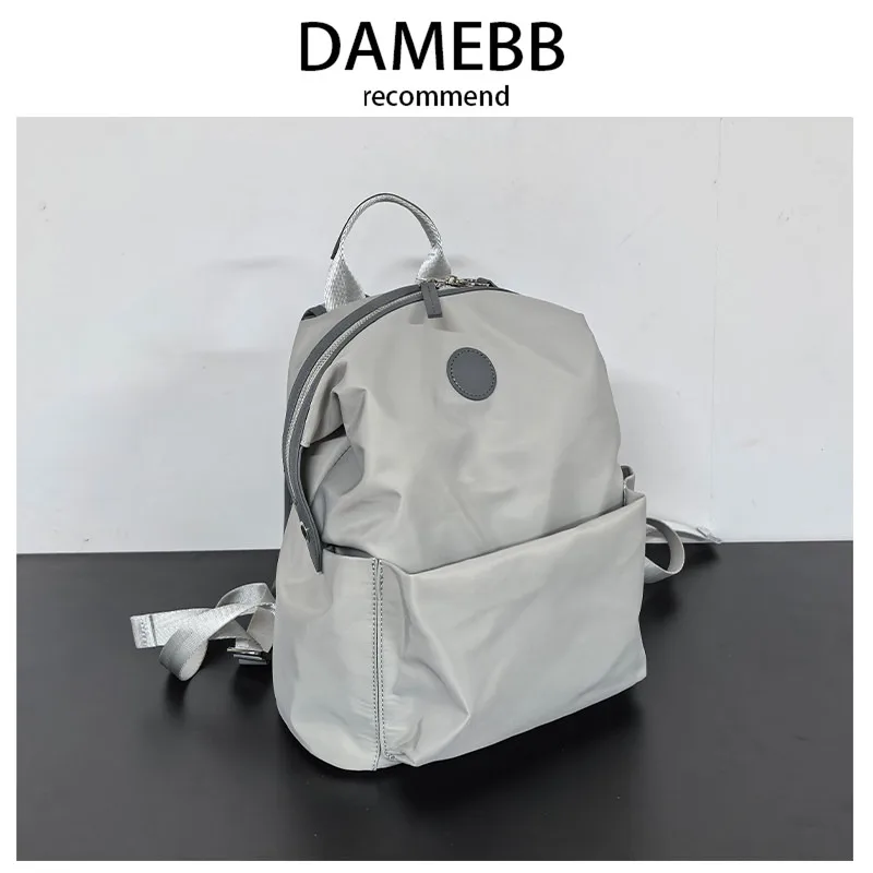 mochila-casual-de-nailon-damebb-de-gran-capacidad-nueva-mochila-escolar-2025-color-puro-doble-asa-para-uso-diario-juvenil