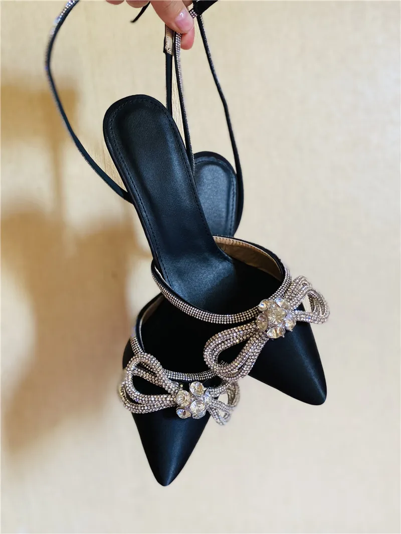 Onlymaker Women Pointed Toe Sandals Silver PVC Black Satin Butterfly-Knot Crystal Bordered Ankle Buckle Thin High Heels Sandals