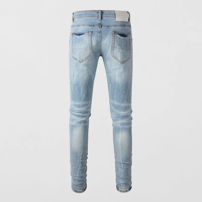 Designer mode nieuwe jeans met geplooide elastische slim fit geperforeerde patch jeans, high street fashion hiphop merk lichtblauw pa