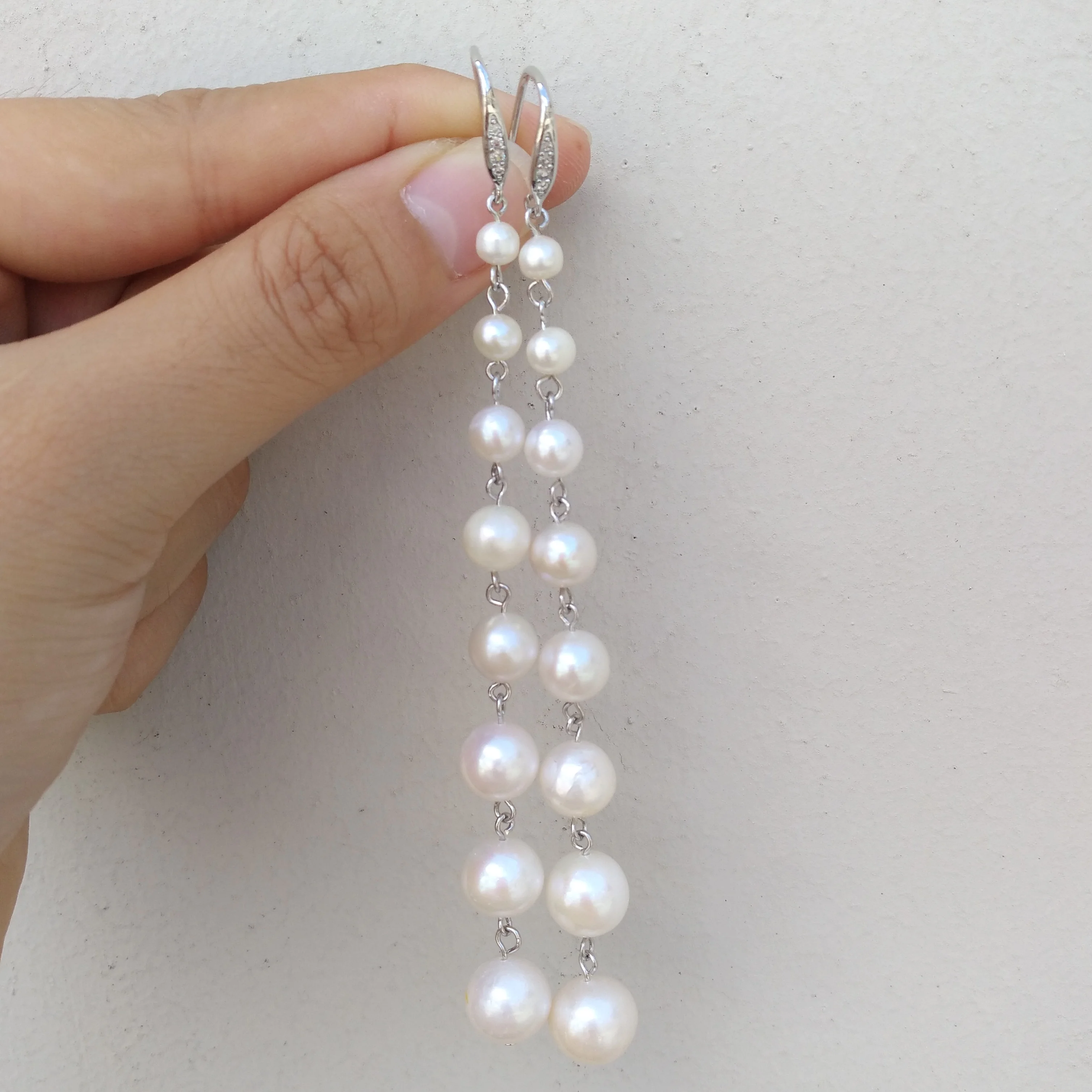 

Dainty Exotic AAA+ 4-9mm South Sea White Natural Long 8 beads Pearl Dangle Hook Earrings Suitable For Any Occasion
