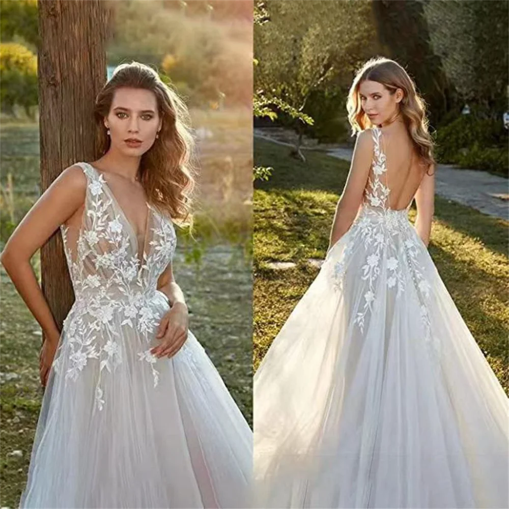 

Gorgeous 2024 Fascinating A Line Wedding Dresses Appliques Lace V-Neck Bride Gowns Sexy Backless Sleeveless Tulle Robes 041