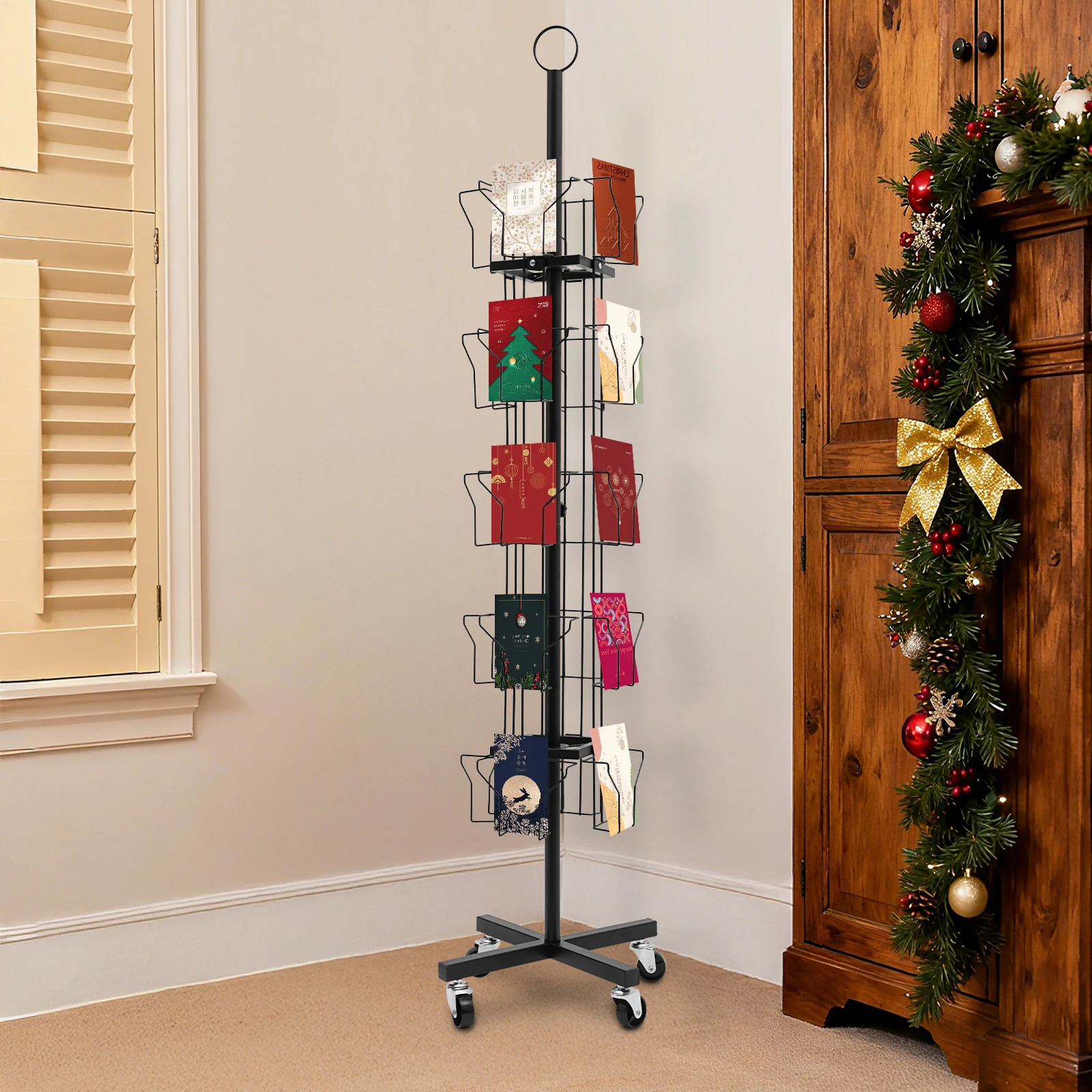 ที่วางการ์ดอวยพรแบบหมุนได้ 5 ชั้น ทำจากเหล็กแผ่นรีดเย็นสีดำ ขนาด 1.52 เมตร พร้อมที่วางแสดงสินค้าแบบเคลื่อนที่ 20 ช่อง พร้อมล้อล็อค