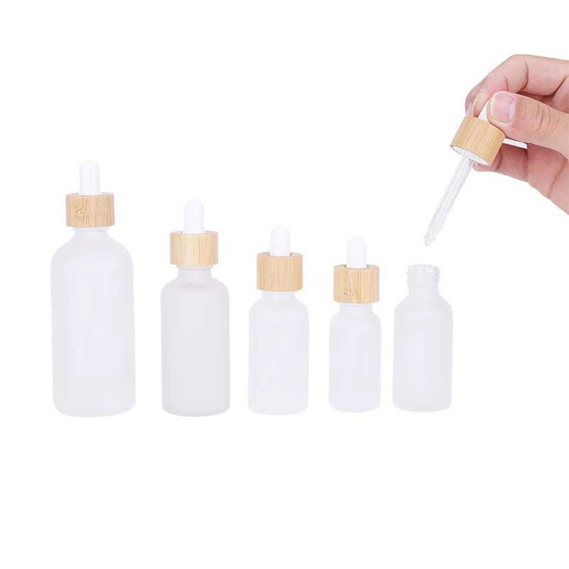 

Clear Oil Glass Dropper Bottle with Bamboo Cap Liquid Pipette Package Essential Oil Glass Dropper Bottle With Bamboo Dropper Cap