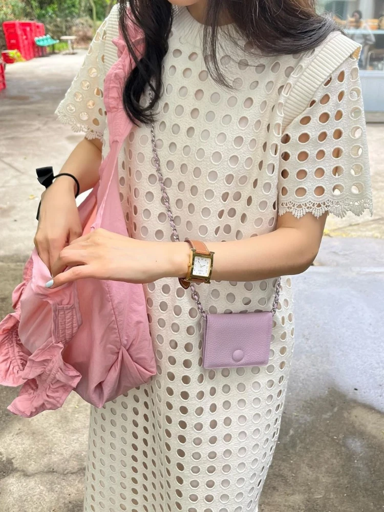 Elegantes Sommerkleid mit Rundhalsausschnitt und ausgehöhltem Design, Nische, lockeres, durchsichtiges, kurzärmliges Kleid für Damen, französische Urlaubs-Robe