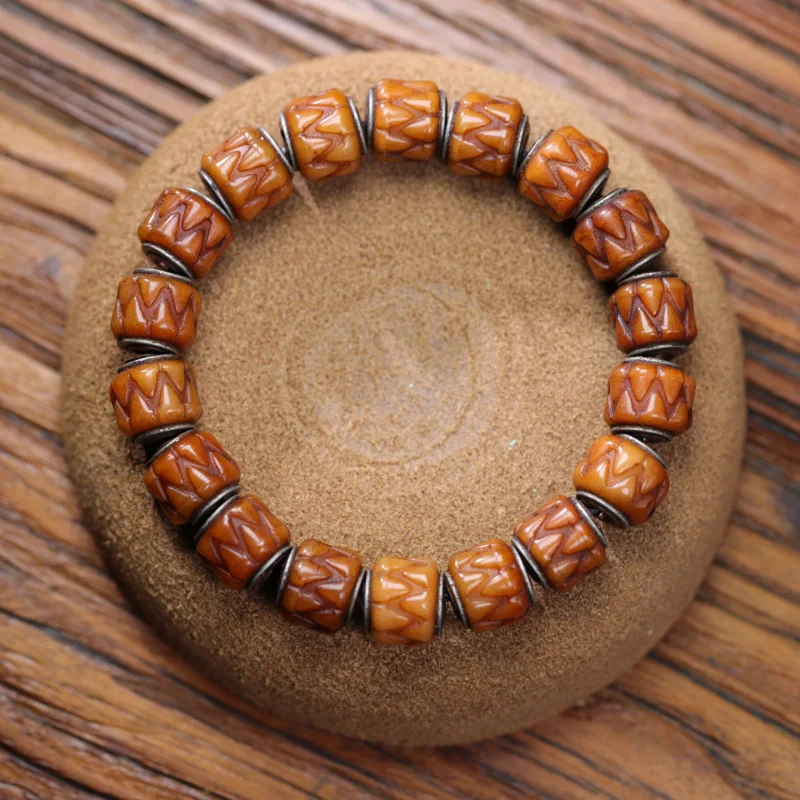 

Браслет из натуральной кости яка с резной серебряной инкрустацией