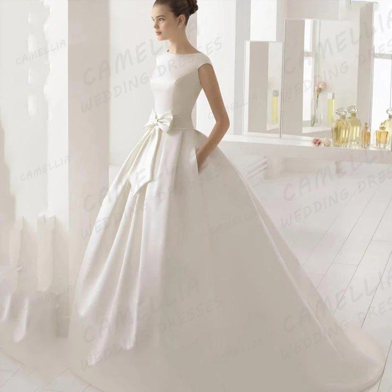 Bellissimi abiti da sposa con applicazioni senza schienale una linea abiti da sposa con fiocco senza maniche Sexy da donna eleganti abiti da sposa in raso