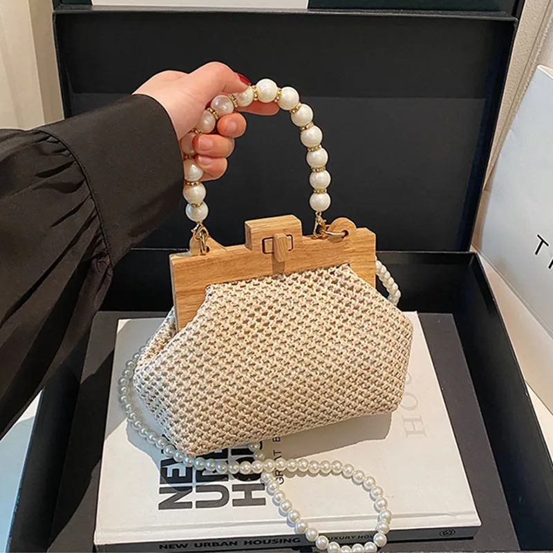 

2025 Luxury Women Wooden Handle Wedding Evening Clutch Bag Trend Design Nice Pearl Chain Woven Straw Handbag Brand Shoulder Bag