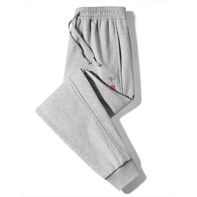 Pantalones largos hasta el tobillo para hombre, cintura elástica, bolsillos bordados sólidos, informales, sueltos, marca de moda, primavera y otoño