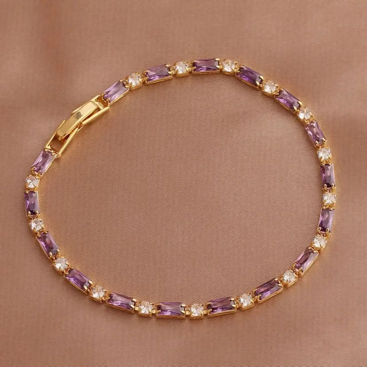 Elegant geometric purple crystal bracelet for women crafted in brass with zircon inlay — champagne gold finish — lightweight lux