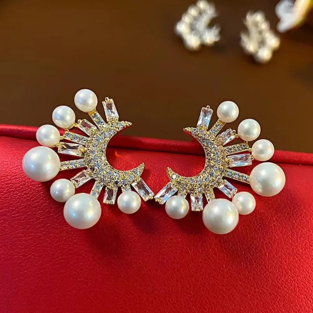 

Vintage Baroque women's earrings with curved moon design and sparkling zircon. Unique design luxurious women's earrings.