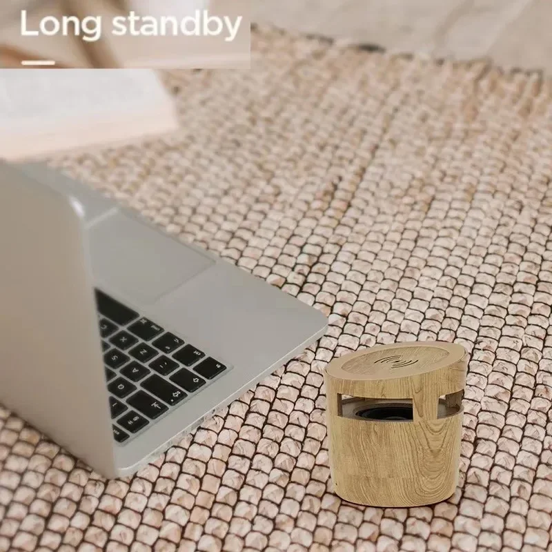 ลำโพงบลูทูธไร้สาย 10W พร้อมที่ชาร์จไร้สาย ดีไซน์ไม้ขนาดเล็กพกพาสะดวก เหมาะสำหรับวางบนโต๊ะหรือใช้งานกลางแจ้ง เสียงเบสหนักแน่น