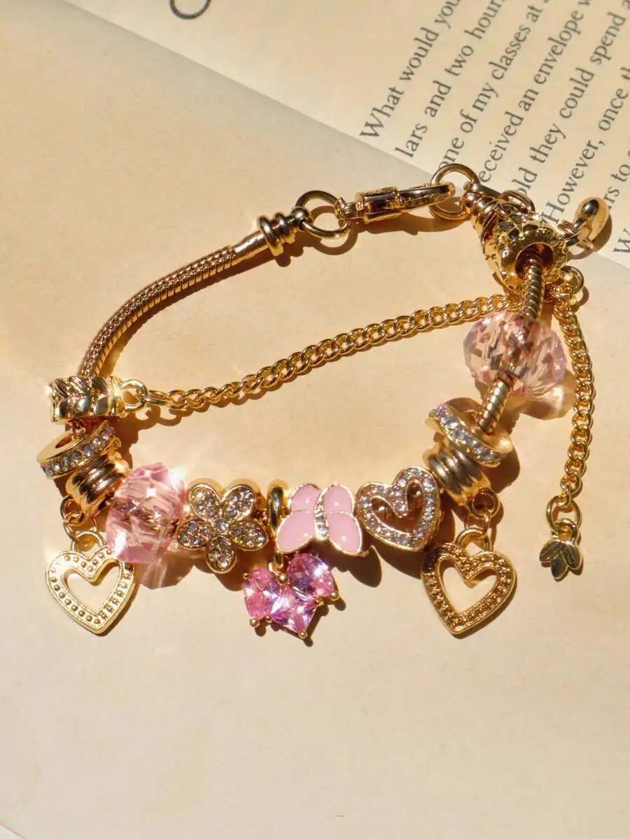 

Charming Gold-Tone Bracelet With Pink Crystal Hearts, Floral And Butterfly Charms For Romantic Occasions