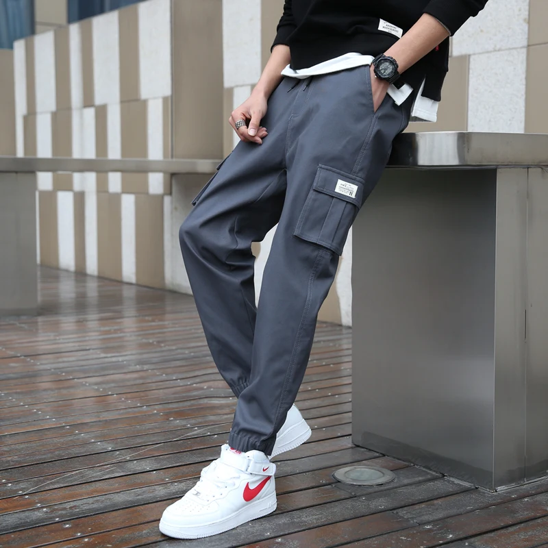 男性用カジュアルワークウェアパンツ 秋 薄手 ゆったり カフ付き トレンド 春夏 コットン ロングパンツ 若者 アクティブスタイル 旅行