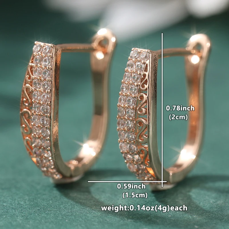 Elegante goldfarbene weiße CZ-Creolen für Damen, handgeschnitzte hohle Ohrringe aus Metall für Party und Alltag – Detail 1
