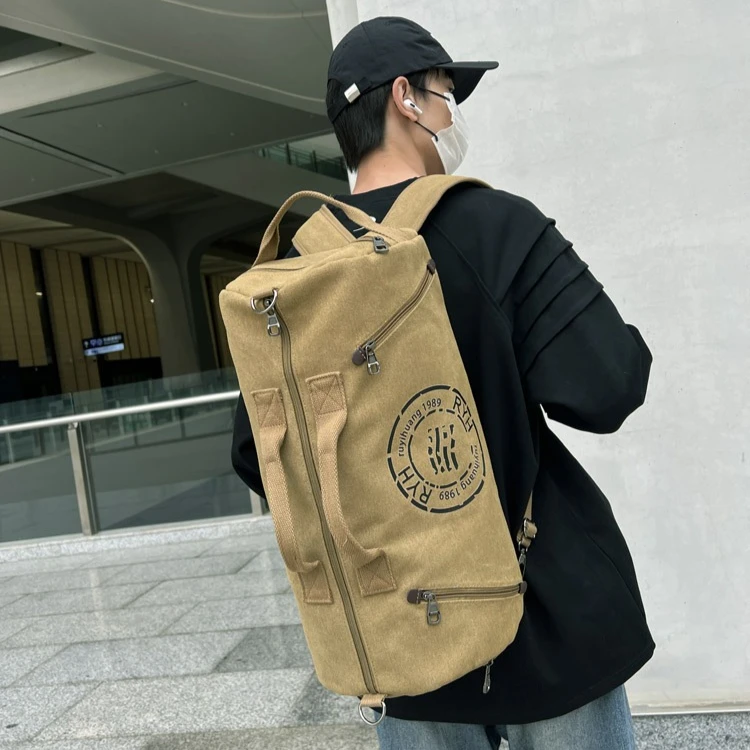 

Large-capacity backpack for men, wear-resistant cylindrical crossbody bag, waterproof canvas hand-held travel bag