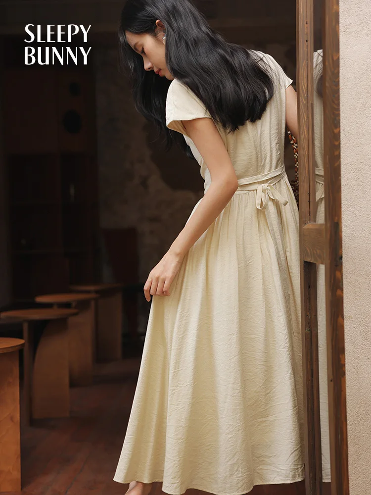 Elegante retro geborduurde jurk getextureerde zomer a-lijn maxi zonnejurk dames korte mouw vloeiende jurk lelie bloemen detail terug stropdas