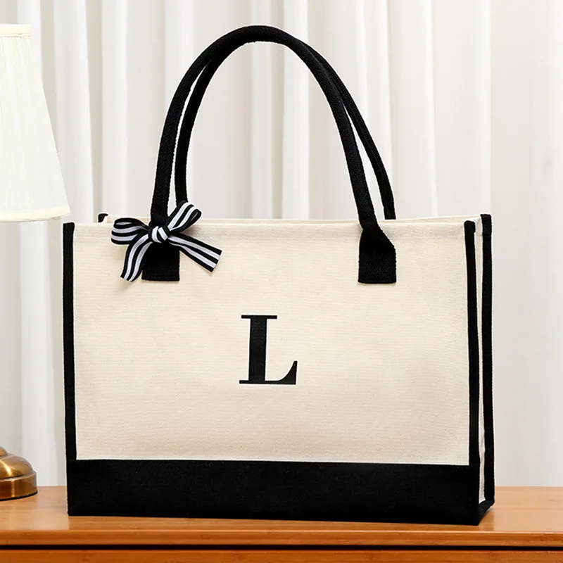

Simple letter printed men's shoulder bag large capacity canvas storage bag gift shopping bag decorated with a bow and ribbon