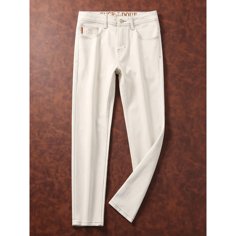 Jeans bianchi alla moda da uomo stile autunnale semplice moda casual abbigliamento da uomo slim fit piccoli pantaloni di lusso leggeri a tubo dritto