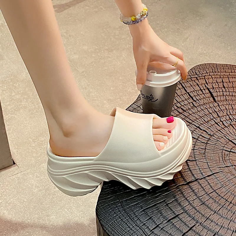 

9Cm heightening eva thick-soled slippers 2026 summer new one-word drag women's outer wear casual versatile beach cool slippers