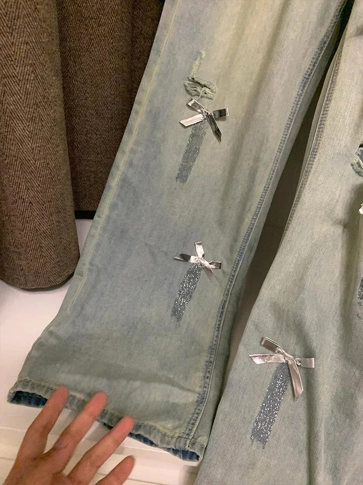 Jeans a gamba larga con fiocco strappato di grandi dimensioni donna americana 2024 estate nuovi pantaloni larghi in Denim sottile con tasca a vita