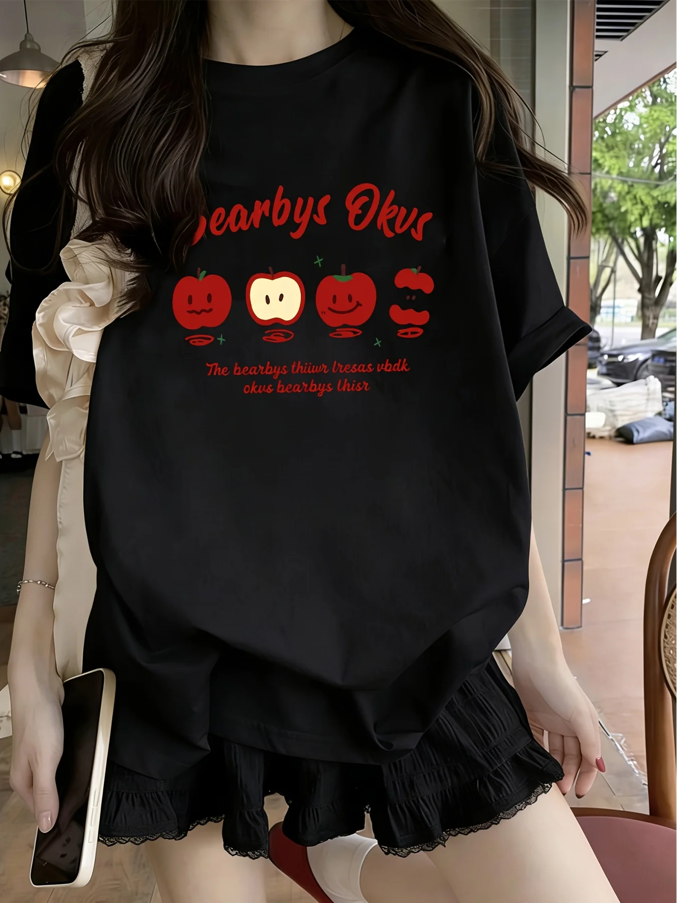 Women's loose casual short-sleeve T-shirt featuring a soft sweet aesthetic and a Y2K-style red apple smiley face and letter