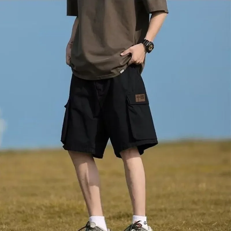 

Половина с карманами, эластичная талия, свободные мешковатые длинные широкие однотонные бермуды, мужские шорты-карго большого размера Hevy Whate