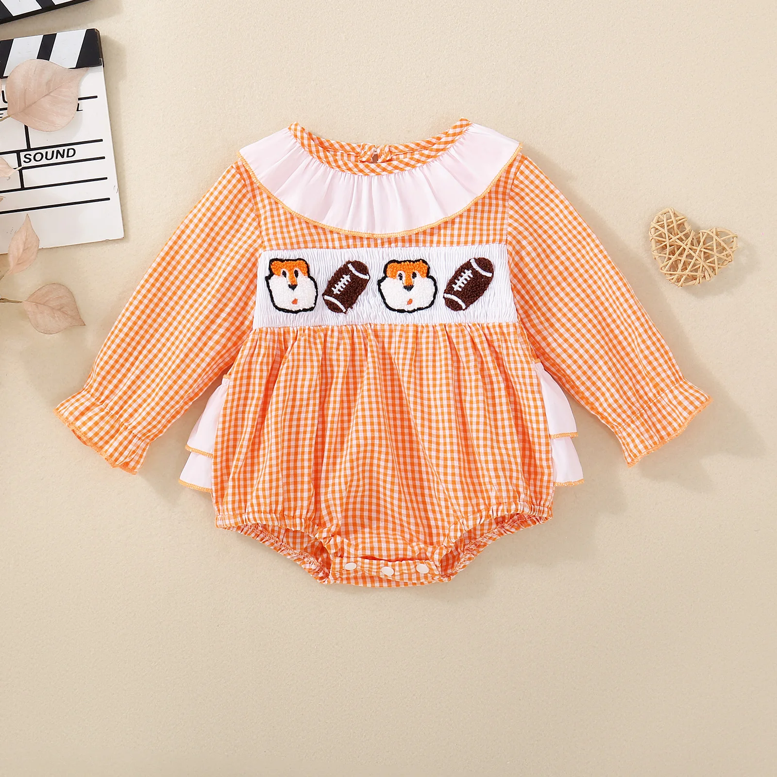 Spring/Autumn long-sleeved knitted bodysuit for baby girls, featuring orange rugby ball embroidery