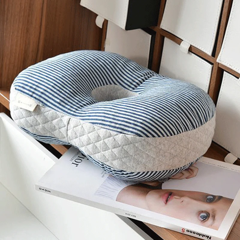 At noon in the office, sleeping pillows lie prone on the table.siesta pillows, siesta pillows, creative pillows with holes