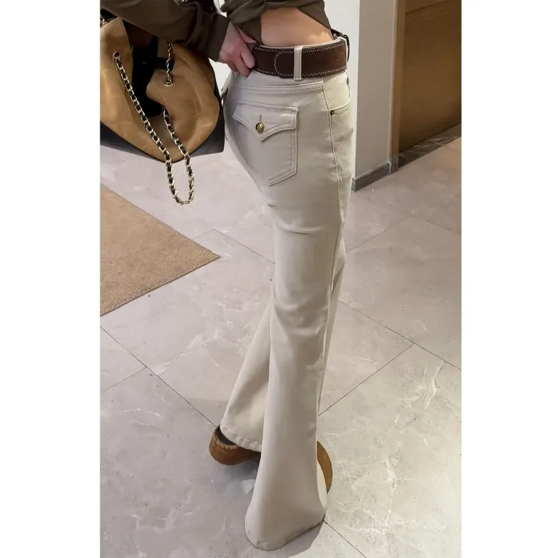 

Rice Apricot Velvet Thickened Micro-pull Jeans Women's 2026 Autumn Winter New High-waisted Elastic Slim-fit Horn Horseshoe Pants