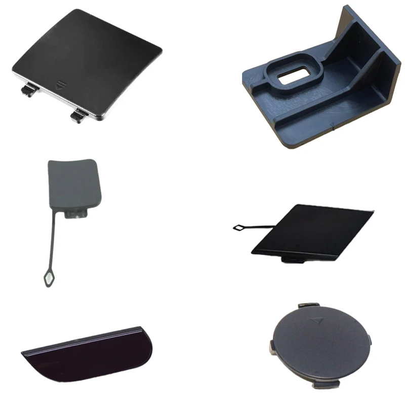 Hinged door, tow hook support, bumper towing ring cover, trailer ring cover, lower trailer ring cover, tow hook assembly, baffle