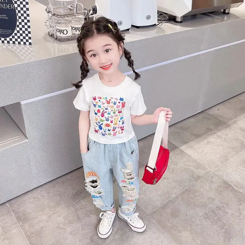 Girls' jeans summer 2025 new children's graffiti torn hole casual pants thin design for boys and girls baby summer pants