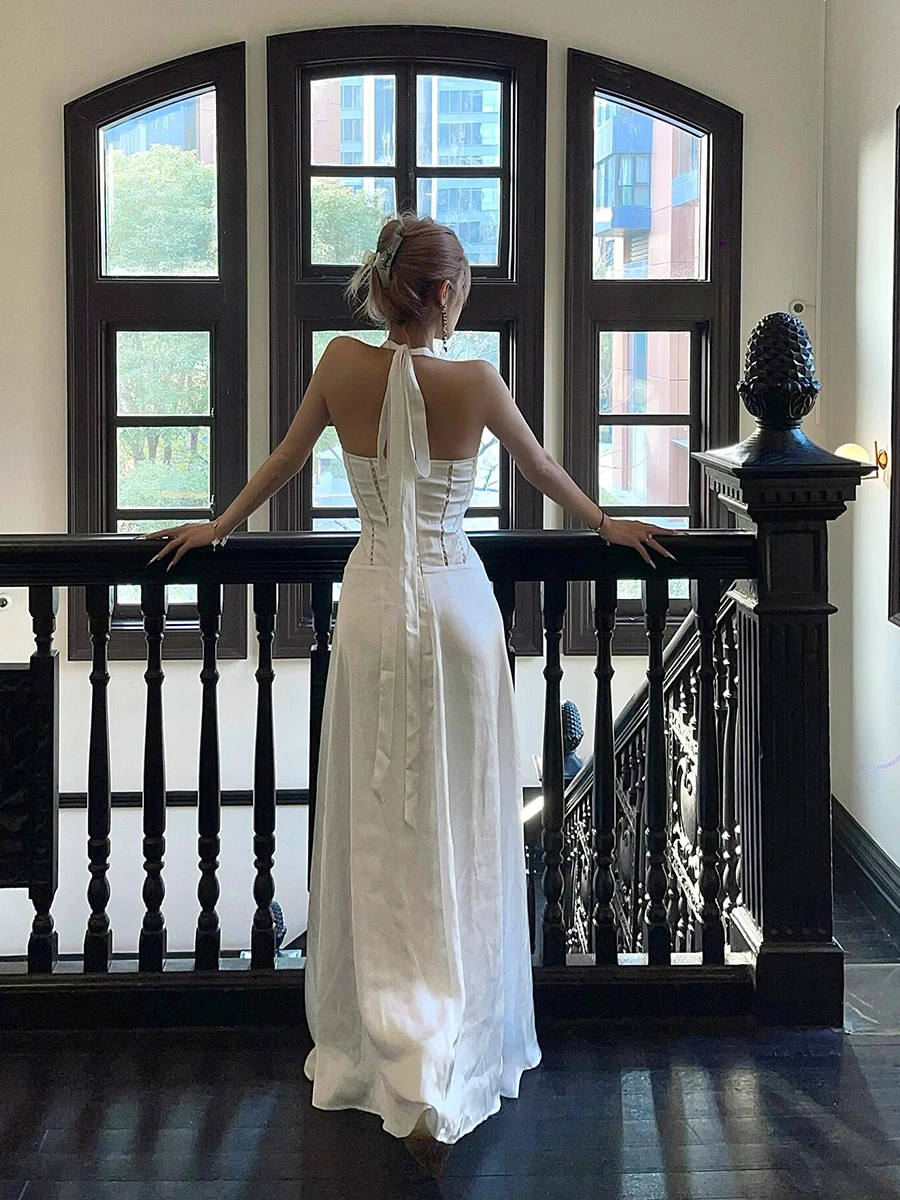 ReddaChic Boog Decor V-hals Vrouwen Feestjurk Wit Satijn Backless Hollow Out Halter Lange Jurk Afstuderen Elegante Zomerkleding