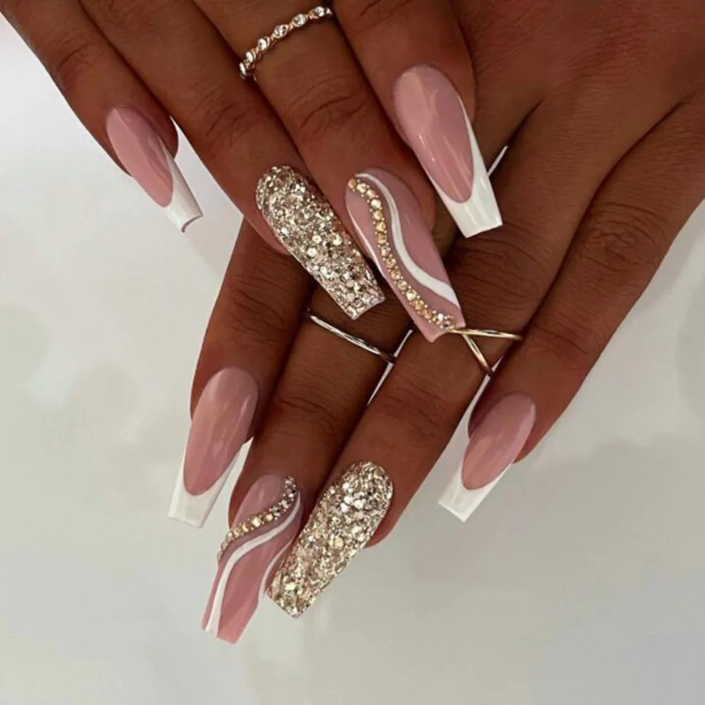

Pink false nail stickers, press-on nails with rhinestones and glitter, long T‑shaped ready-to-wear manicure.