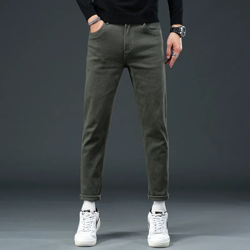 Vaqueros sencillos y lujosos para hombre en otoño de 2025, con ajuste elástico y pantalones casuales de negocios urbanos de alta gama