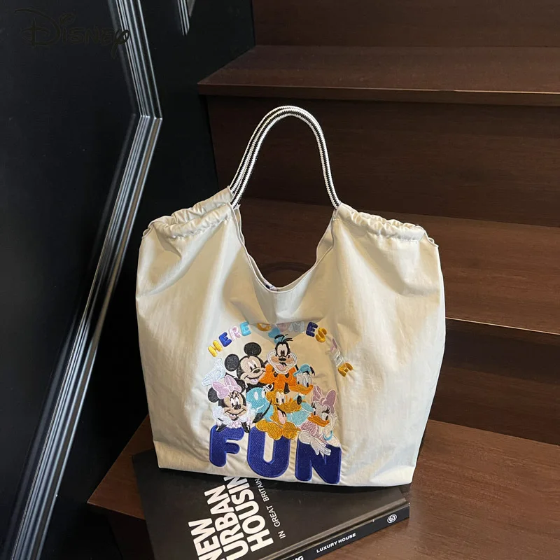 

Disney Mickey 2025 New Women's Handbag Fashion High Quality Women's Shoulder Bag Cartoon Versatile Large Capacity Shopping Bag