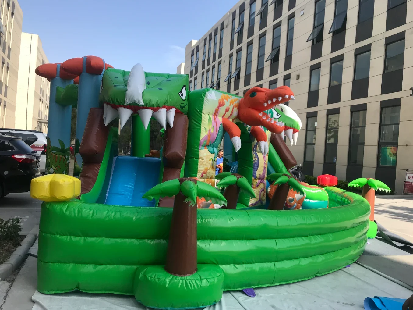 Large inflatable amusement park dinosaur theme inflatable trampoline paddling pool double slide swimming pool