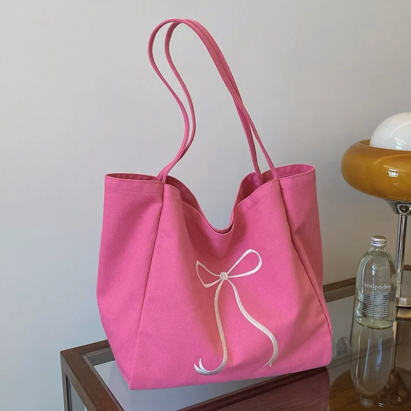 

Large capacity bow embroidered canvas tote bag for girls' hearts, cute one shoulder cloth bag for commuting to work, hand-held