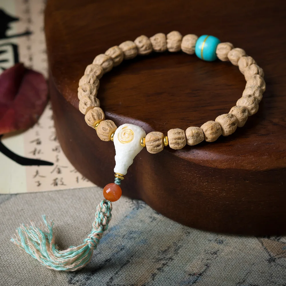 

Winter on the new Baixiang seed bracelet original cultural toys antler tee Chinese hand braided strings