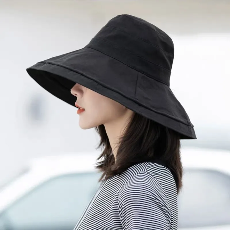 A wide-brimmed fisherman's hat covering the face women's literary sun-protective basin and trendy shade
